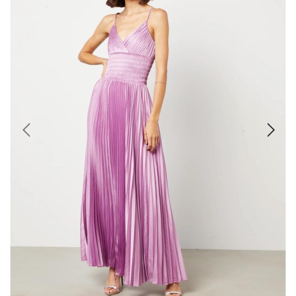 Absolutely gorgeous pleated BCBG gown. Length professionally altered.